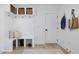 Mudroom with built-in bench and cubbies provide stylish storage alongside a convenient door for easy access at 705 Vine Pkwy, Pittsboro, NC 27312