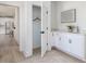Mudroom sink and white cabinets near an open closet creates an inviting and practical transition space at 705 Vine Pkwy, Pittsboro, NC 27312