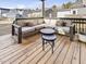 Inviting covered outdoor seating area featuring a cozy sectional and coffee table at 705 Vine Pkwy, Pittsboro, NC 27312