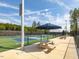 A view of the community pickleball courts with shade umbrellas and picnic tables at 705 Vine Pkwy, Pittsboro, NC 27312