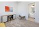 Cozy room with fun art and a small table and chairs are complemented by convenient access to an adjacent bathroom at 705 Vine Pkwy, Pittsboro, NC 27312