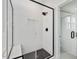 Modern shower featuring black fixtures, white subway tile, glass enclosure, and a built-in bench at 705 Vine Pkwy, Pittsboro, NC 27312