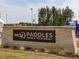 Paddles Swim & Pickleball sign at entrance made of stone bricks at 705 Vine Pkwy, Pittsboro, NC 27312