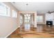 Dining room area with hardwood floors and view to the fireplace in the living room at 711 Gaston Manor Dr, Durham, NC 27703