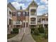 Charming townhome with brick accents, a welcoming porch, and beautifully landscaped grounds at 9211 Calabria Dr # 117, Raleigh, NC 27617