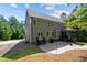 Spacious backyard with a stone patio, screened in porch and beautiful landscaping at 766 Horizon Dr, Pittsboro, NC 27312