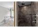 Beautiful bathroom with a soaking tub adjacent to the tiled walk-in shower with built in bench and rainfall shower head at 766 Horizon Dr, Pittsboro, NC 27312