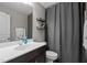 Bathroom featuring a modern vanity, shower with a gray curtain and shelving at 766 Horizon Dr, Pittsboro, NC 27312