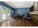 Spacious bonus room with hardwood floors, stylish bar area, and natural light at 766 Horizon Dr, Pittsboro, NC 27312
