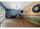 Entertainment room featuring hardwood floors, a bar area, and plenty of space for recreation at 766 Horizon Dr, Pittsboro, NC 27312