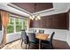 Elegant dining room with hardwood floors, large window, and stylish lighting at 766 Horizon Dr, Pittsboro, NC 27312
