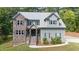 Charming two-story home with stone accents and a well-manicured lawn at 766 Horizon Dr, Pittsboro, NC 27312