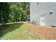 Exterior home view featuring a well manicured lawn, HVAC system and a small porch at 766 Horizon Dr, Pittsboro, NC 27312