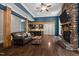 This living room features hardwood floors, a stone fireplace and a seamless flow into the kitchen at 766 Horizon Dr, Pittsboro, NC 27312
