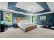 Spacious main bedroom with tray ceiling, lots of natural light, and a dedicated workout area at 766 Horizon Dr, Pittsboro, NC 27312