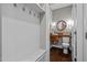 Charming powder room with a custom wood vanity and a unique round mirror at 766 Horizon Dr, Pittsboro, NC 27312