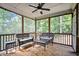 Relaxing screened porch with comfortable seating overlooking a wooded area at 766 Horizon Dr, Pittsboro, NC 27312