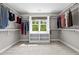 Spacious walk-in closet with built-in shelving and racks featuring a window at 766 Horizon Dr, Pittsboro, NC 27312