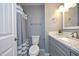 Cozy bathroom with shower/tub, a modern vanity with storage, and a tiled floor for a comfortable space at 7736 Falcon Rest Cir, Raleigh, NC 27615
