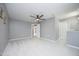 Spacious bedroom with ceiling fan, fresh paint and new carpet at 7736 Falcon Rest Cir, Raleigh, NC 27615
