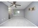 Bright bedroom featuring a ceiling fan, fresh paint and new carpet at 7736 Falcon Rest Cir, Raleigh, NC 27615