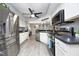 Modern kitchen features stainless steel appliances, light wood flooring and bright lighting at 7736 Falcon Rest Cir, Raleigh, NC 27615
