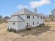 Spacious two-story home with a well-maintained backyard, patio, and lush green surroundings at 7880 Flower Hill Rd, Middlesex, NC 27557