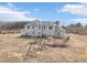 Large fenced backyard with swing, mature trees, and ample play space at 7880 Flower Hill Rd, Middlesex, NC 27557