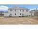 Back of the house with a large backyard, wooden decks, and a chain link fence at 7880 Flower Hill Rd, Middlesex, NC 27557