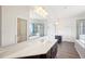 Bright bathroom featuring double vanity, large mirror, soaking tub, and glass shower enclosure at 7880 Flower Hill Rd, Middlesex, NC 27557