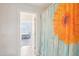 View of a bathroom and doorway with a colorful shower curtain in the foreground at 7880 Flower Hill Rd, Middlesex, NC 27557