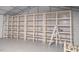 View of garage featuring shelving for storage and workbench space at 7880 Flower Hill Rd, Middlesex, NC 27557