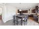 Bright kitchen with a dark cabinets, granite countertops, stainless steel appliances, and an eat-in kitchen table at 7880 Flower Hill Rd, Middlesex, NC 27557