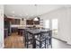 Eat-in kitchen featuring wood cabinets, granite countertops, stainless appliances and door to the deck at 7880 Flower Hill Rd, Middlesex, NC 27557
