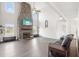 Spacious living room with tall stone fireplace, and lots of natural light at 7880 Flower Hill Rd, Middlesex, NC 27557
