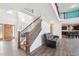 Open floor plan with staircase, dark wood floors, and view of the kitchen at 7880 Flower Hill Rd, Middlesex, NC 27557