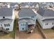 Aerial view of the house and backyard with a screened porch at 8008 Hergety Dr, Raleigh, NC 27603