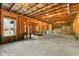 Unfinished basement with exposed framework and a view from the window at 8008 Hergety Dr, Raleigh, NC 27603