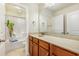 Bathroom featuring a vanity and a shower-tub combination with a world map shower curtain at 8008 Hergety Dr, Raleigh, NC 27603
