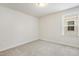 Bright bedroom features a window bringing in natural light and neutral paint at 8008 Hergety Dr, Raleigh, NC 27603