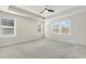 Large bedroom with bright windows and neutral walls at 8008 Hergety Dr, Raleigh, NC 27603