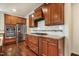 Modern kitchen featuring stainless steel appliances, granite countertops, and custom cabinets at 8008 Hergety Dr, Raleigh, NC 27603