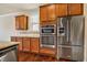 Updated kitchen with granite countertops, stainless appliances, and custom cabinetry at 8008 Hergety Dr, Raleigh, NC 27603