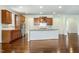 This kitchen features wood cabinets, granite countertops, and stainless steel appliances at 8008 Hergety Dr, Raleigh, NC 27603