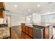 The kitchen features wood cabinets, granite countertops, and stainless steel appliances at 8008 Hergety Dr, Raleigh, NC 27603