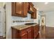 Contemporary kitchen with granite countertops, stainless appliances, and custom cabinetry at 8008 Hergety Dr, Raleigh, NC 27603