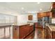 Spacious kitchen with stainless steel appliances, hardwood floors, and granite countertops at 8008 Hergety Dr, Raleigh, NC 27603