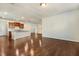 A spacious living room features dark wood floors and is open to the kitchen at 8008 Hergety Dr, Raleigh, NC 27603