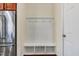This mudroom features a built in bench with storage and coat hooks at 8008 Hergety Dr, Raleigh, NC 27603