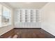 Office space with built-in bookshelves, hardwood floors, and ample natural light at 8008 Hergety Dr, Raleigh, NC 27603